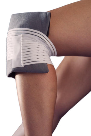 FlexiFreeze ice pack secured with a white elastic strap around a human knee