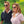 Man and woman wearing Ontel white wearable neck fans outdoors