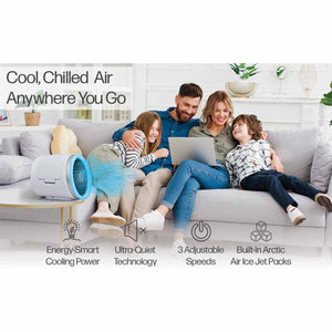Ontel portable air cooler on a table with a family sitting on a sofa in the background