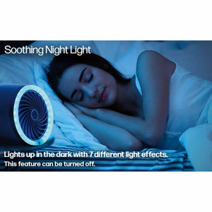 Ontel portable fan with seven color night light feature shown in a dark bedroom