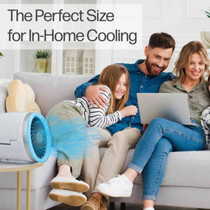 Ontel portable fan on a side table next to a family sitting on a couch