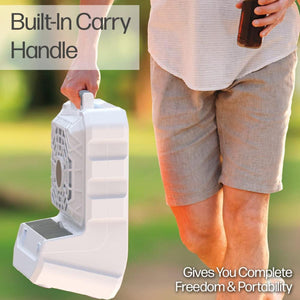 Person carrying an Ontel portable fan by the built in handle