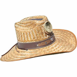 Straw cowboy hat with a brown leather band and a circular metal accent
