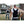 Two men wearing black Onyx Cool cooling vests while carrying wooden construction materials outdoors