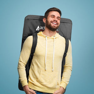 Man wearing a yellow hoodie carrying an ActionHeat branded black backpack