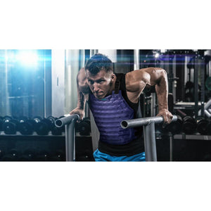 Man performing dips in a gym wearing a purple AlphaCool cooling vest