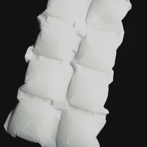 Oro Sports white ice pack sheet with multiple square compartments on black background