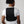 Person wearing Oro Sports black mesh back support brace over a white t-shirt