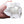 Hand holding a crumpled white Oro Sports tissue