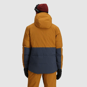 Back view of person wearing Outdoor Research two-tone mustard and navy hooded ski jacket with Smith beanie