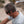 Person wearing black Outdoor Tech bone conduction headphones