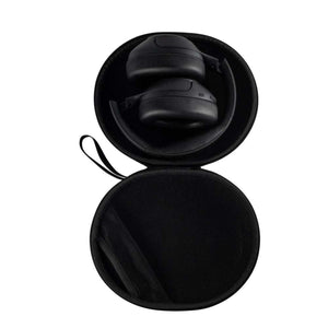 Outdoor Tech black headphones inside a circular protective carrying case
