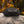 Outdoor Tech black geometric portable speaker on a rock