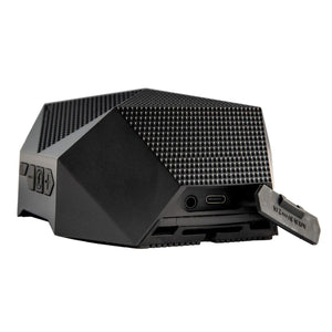 Outdoor Tech black portable speaker with open charging port and aux input