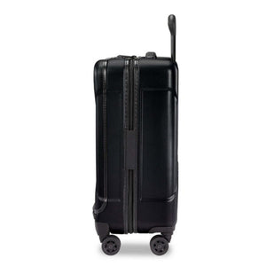 Side view of a black Briggs and Riley hard shell carry on suitcase with four wheels and an extended handle