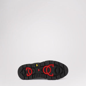 Black Pajar boot sole with red circular tread patterns