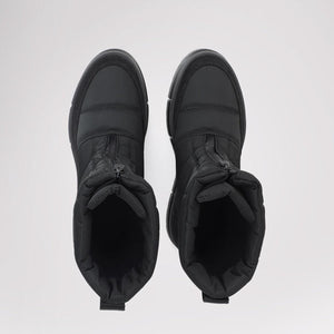Pair of black quilted ankle boots with front zipper closure viewed from above