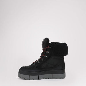 Black winter boot with faux fur cuff and thick grey lug sole