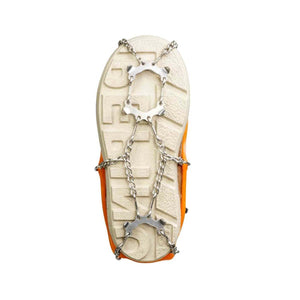 Orange shoe with metal ice traction cleats attached to the sole