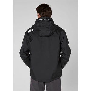 Back view of a person wearing a black Helly Hansen hooded jacket