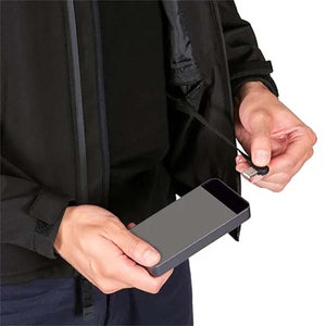 Pioneer jacket with integrated USB charging cable connected to a power bank