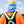 Worker wearing a yellow hard hat with a blue neck shade and a high visibility orange shirt with a safety harness