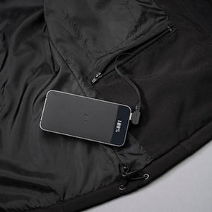 Pioneer power bank connected to a charging cable inside a black jacket pocket