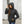 Woman wearing a black Kelvin hooded softshell jacket