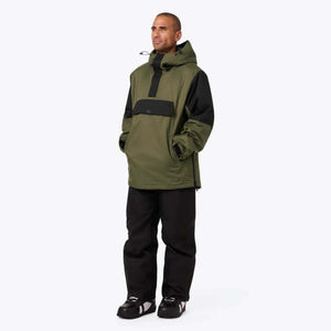 Man wearing Mobile Warming olive green and black hooded pullover jacket with black pants