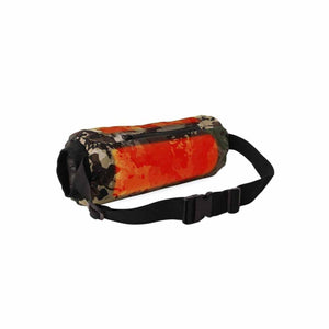 Cylindrical waist bag with orange and camouflage pattern and black adjustable strap