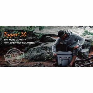 Man kneeling by a river with a grey Polar Bear Topper 30 cooler