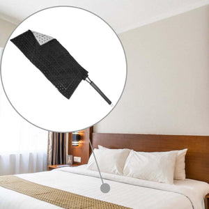 Black microfiber duster head with handle shown above a made hotel bed