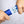 Hands using a blue Polar Products hand grip strengthener