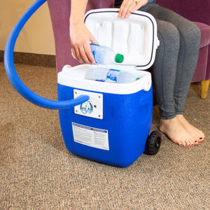 Person placing water bottle into Polar Products active cold therapy system cooler