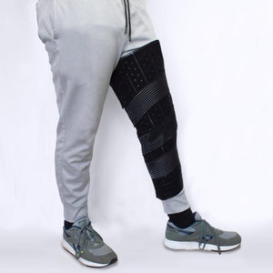 Polar Products black leg compression wrap worn over grey sweatpants