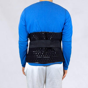 Polar Products black perforated back support brace worn over a blue long sleeve shirt