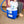 Person placing water bottles into a Polar Products cold therapy cooler