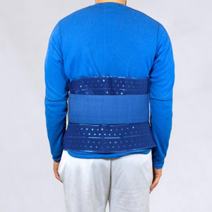 Person wearing a blue Polar Products back support wrap over a blue long sleeve shirt