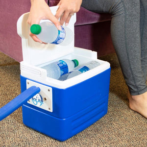Person placing a water bottle into a blue Polar Products cooler
