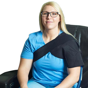 Woman wearing a black Polar Products shoulder brace over a blue shirt