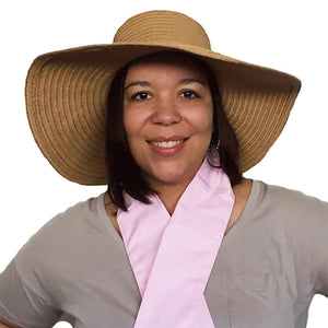 Woman wearing a straw hat and a pink Polar Products cooling neck wrap