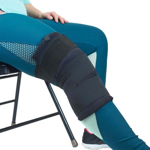 Black knee brace with adjustable straps worn on a leg