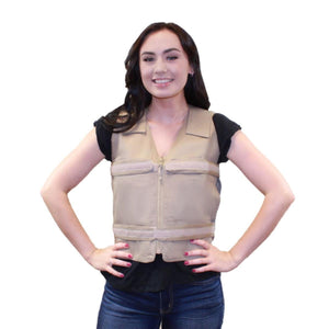 Woman wearing a tan tactical vest over a black shirt