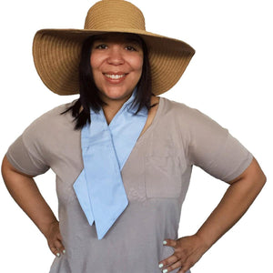 Woman wearing a wide brim straw hat and a light blue cooling neck wrap