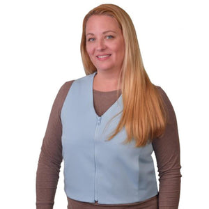Woman wearing a light blue zip front cooling vest over a brown long sleeve shirt