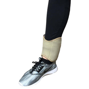 Polar Products beige ankle cooling wrap worn over black leggings and a grey sneaker