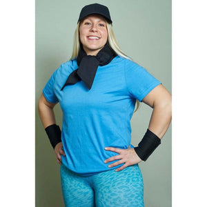 Person wearing Polar Products black cooling neck wrap and wrist bands with blue shirt and cap