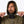Man wearing a Mobile Warming olive green hooded jacket with black accents