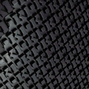 Close up of K1 Ice Cleats tread pattern with repeating logo texture