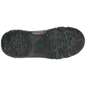 Black Muck boot tread sole with green circular traction pods